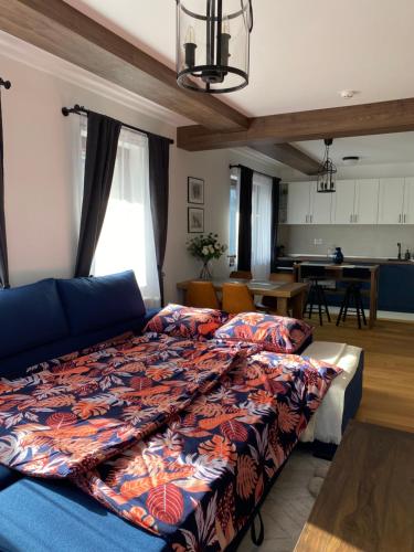 a bedroom with a bed and a living room at Vidik B30 in Kopaonik