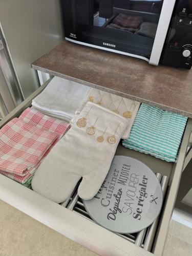 a shelf with two pairs of socks on a counter at La Villa du Soleil in Sukošan