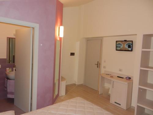 a bathroom with a sink and a toilet in a room at Affittacamere le Tre Sorelle in Sirolo
