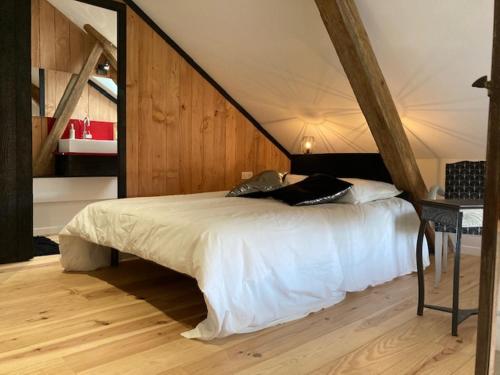 A bed or beds in a room at Les gites de la Vallée Noire