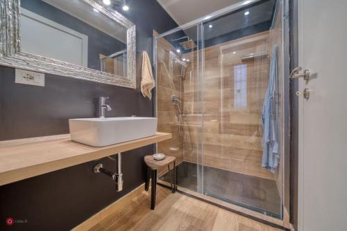 a bathroom with a sink and a shower at San secondo street in Turin