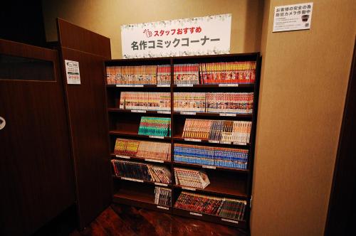 a book shelf full of dvds in a room at Anshin Oyado Akihabara Denkigaiten in Tokyo