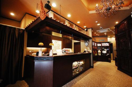a bar in a store with a fireplace in a room at Anshin Oyado Akihabara Denkigaiten in Tokyo