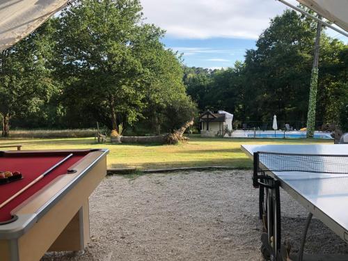 a ping pong table and a ping pong table at La Forestine in Bergerac