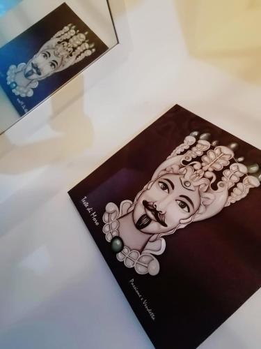 a brochure with a picture of a woman at Historic Centre - Apartment Near Teatro Massimo in Palermo