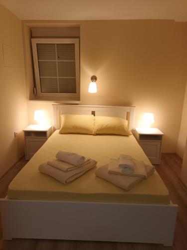 Postel nebo postele na pokoji v ubytování Apartman Marina