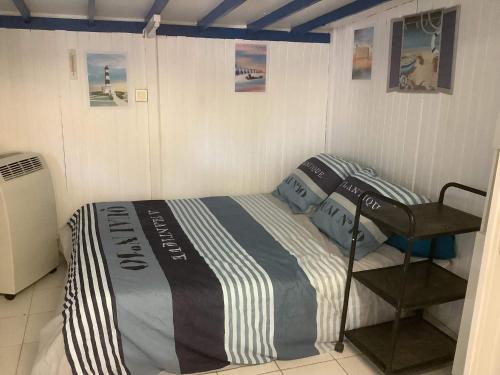 Postel nebo postele na pokoji v ubytování La cabane Oléronnaise