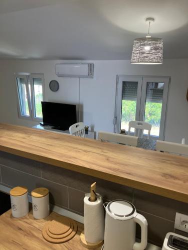 a kitchen with a counter with three mugs at Mia Casa in Tivat