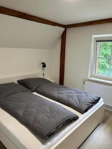 Postel nebo postele na pokoji v ubytování Ferienhaus „de Fofftein“ in Bockhöft