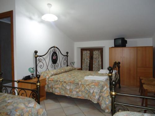 Postel nebo postele na pokoji v ubytování Agriturismo Grisciano
