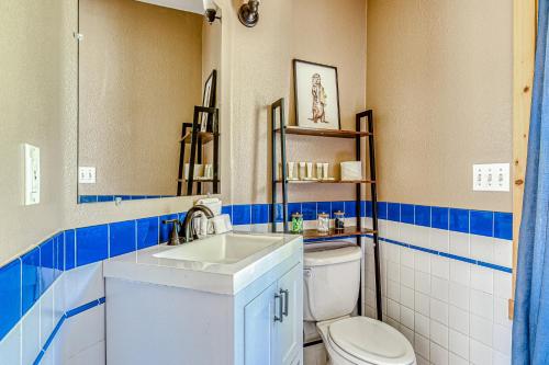 a bathroom with a white toilet and a sink at Second Chair Inn in Rhododendron