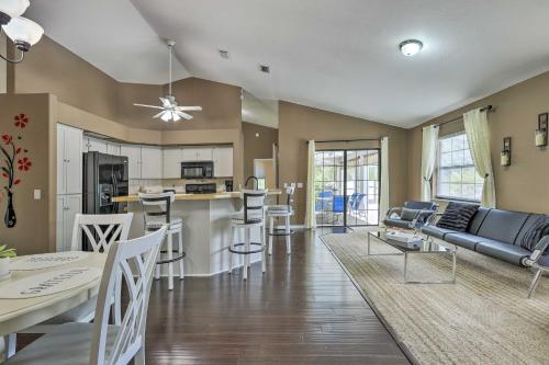 a living room and kitchen with a couch and a table at Ocala Escape with Private Pool, Pets Welcome! in Marion Oaks