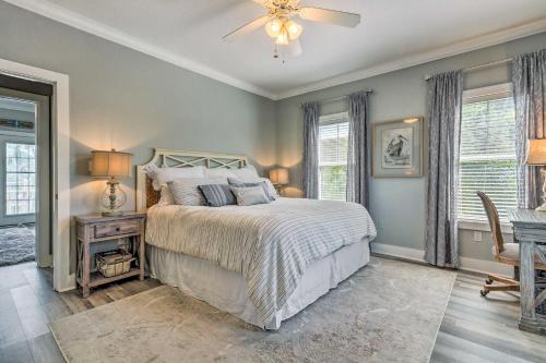 a bedroom with a bed and a ceiling fan at Sunny Perdido Key Cottage with On-Site Tiki Bar in Pensacola