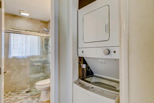 a small bathroom with a toilet and a sink at Dunes Villas in Hilton Head Island