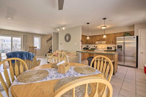 a kitchen and dining room with a table and chairs at Brigantine Retreat with Balconies - Walk to Beach! in Brigantine