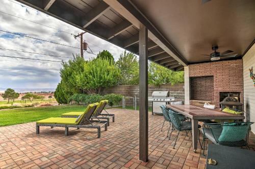 a patio with a table and chairs and a grill at Lake Powell Views Mid-Century Home in Page in Page