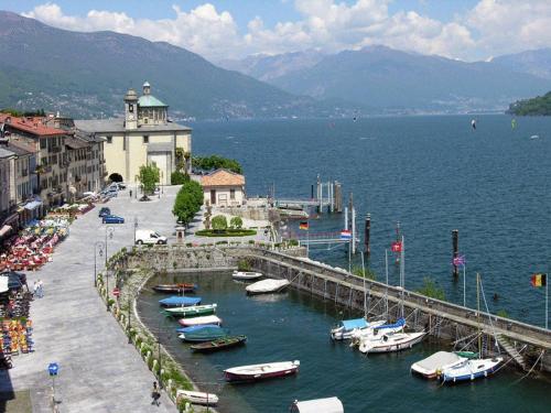 a group of boats are docked in a harbor at Hotel Cannobio in Cannobio