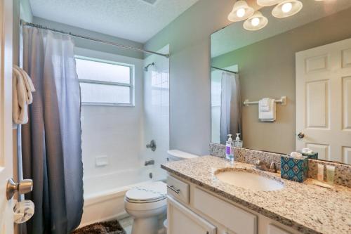 a bathroom with a sink and a toilet and a mirror at Hawkins Cove in Sandalwood