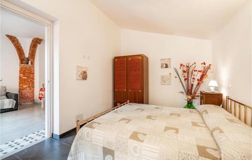 a bedroom with a large bed in a room at Stunning Apartment In La Spezia With 1 Bedrooms And Wifi in La Spezia