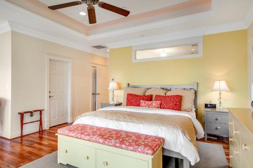a bedroom with a large bed with red pillows at The Ship's Bridge in Annapolis