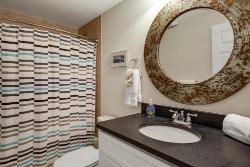 a bathroom with a sink and a mirror at The Ship's Bridge in Annapolis