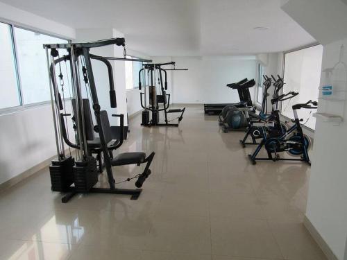 a gym with several exercise bikes in a room at Palmetto2803 in Cartagena de Indias