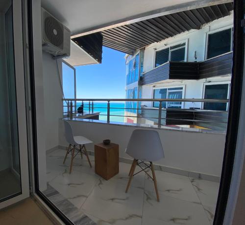 a balcony with a view of the ocean at Beachfront Marilyn in Durrës