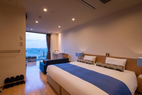 Кровать или кровати в номере Auberge Fontaine Bleau Atami