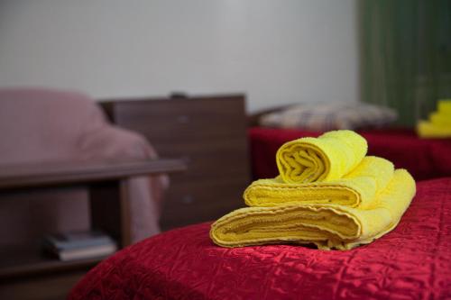 a bunch of bananas sitting on top of a bed at Livadiya Inn in Samara