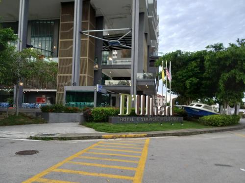 a building with a sign that reads hotel and entrepreneurship at Sunset View 969 PD Waterfront in Port Dickson