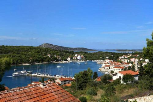 a view of a harbor with boats in the water at Apartments by the sea Prvic Luka, Prvic - 13845 in Prvić Luka