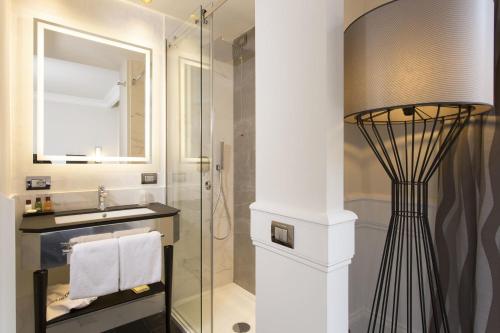 a bathroom with a shower and a sink and a mirror at Palazzo Navona Hotel in Rome