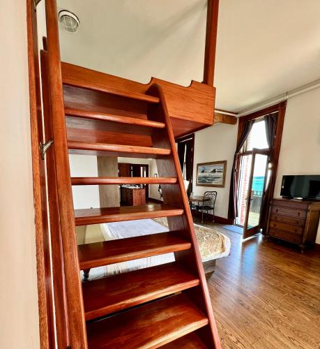 a spiral staircase in a room with a living room at The Monarch Hotel in Port Townsend