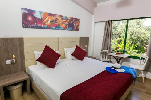 Ένα ή περισσότερα κρεβάτια σε δωμάτιο στο Fitosinn Hotel