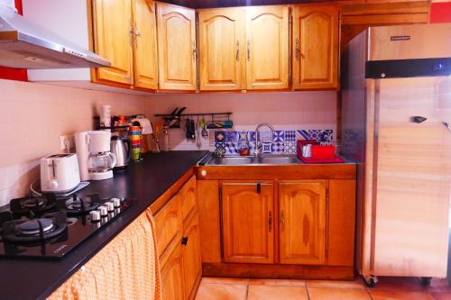 A kitchen or kitchenette at Les Baroudeurs Hostel