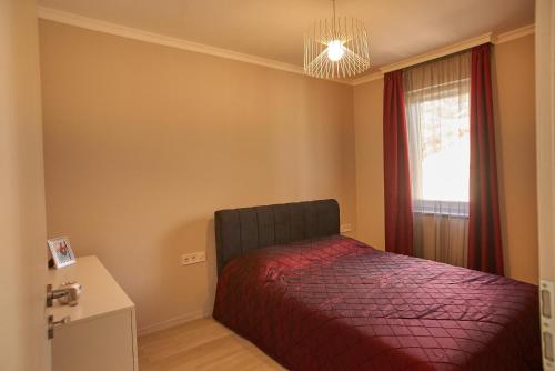 Postel nebo postele na pokoji v ubytování SUNLIGHT Red Szeged