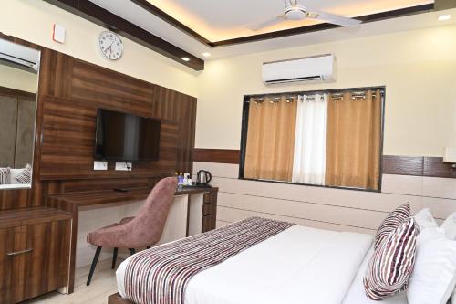 Postel nebo postele na pokoji v ubytování Hotel Vasdaa Grand