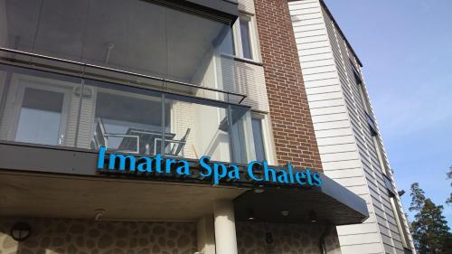 a sign on the side of a building at Finlandia Hotel Imatran Kylpylä Spa in Imatra