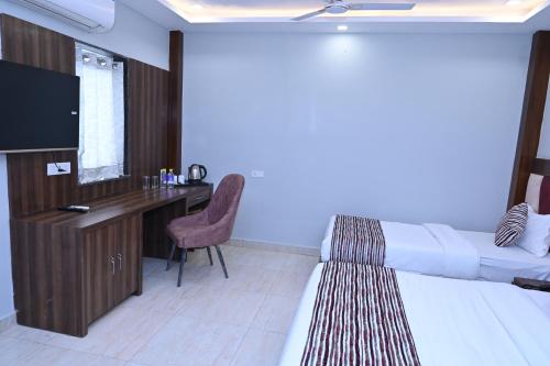 Postel nebo postele na pokoji v ubytování Hotel Vasdaa Grand