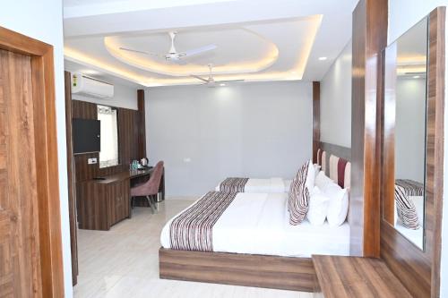 Postel nebo postele na pokoji v ubytování Hotel Vasdaa Grand