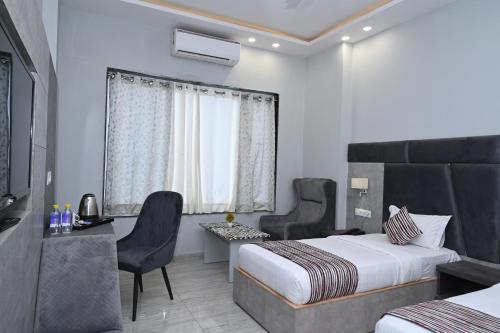 Postel nebo postele na pokoji v ubytování Hotel Vasdaa Grand