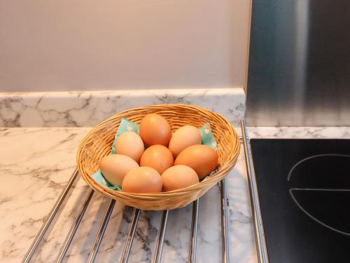 a basket of eggs sitting on top of an oven at The Ticket Office Allerston in Pickering