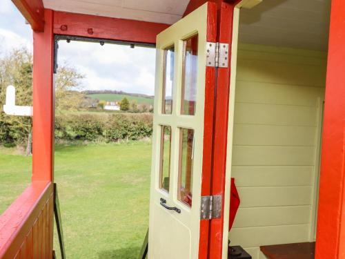 a door on a house with a view of a yard at The Ticket Office Allerston in Pickering