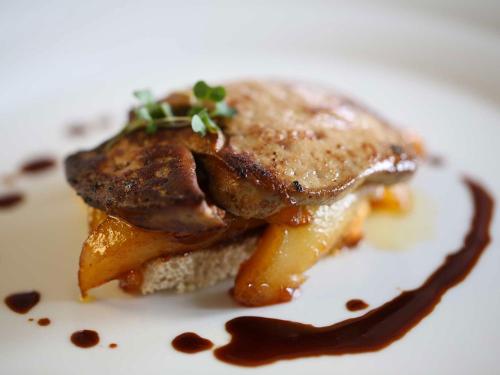 a piece of food on a white plate at Le Muse Hotel in San Bonifacio