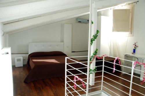 Postel nebo postele na pokoji v ubytování B&B Antico Castello