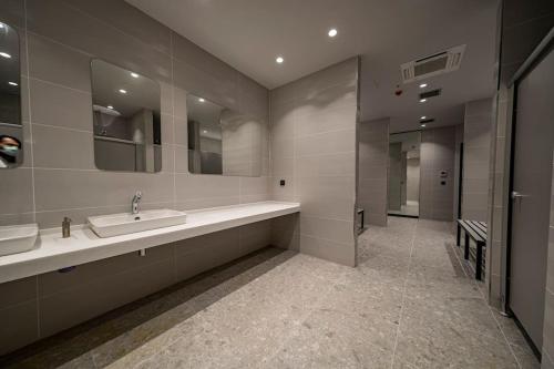 a bathroom with a sink and a mirror at Classy, quality furnished residence-7/24 security ( Benesta 189 ) in Istanbul