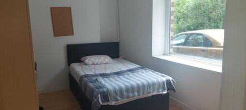 Katil atau katil-katil dalam bilik di Cosy House Relaxing Rooms close to all amenities