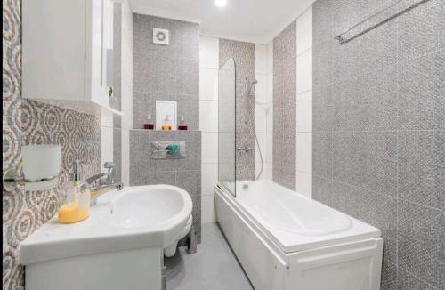 Koupelna v ubytování Moderna Apartment