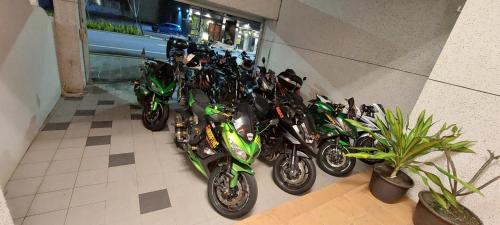 a bunch of motorcycles parked in a room at Trip Village-Hulk's Homestay in Taitung City