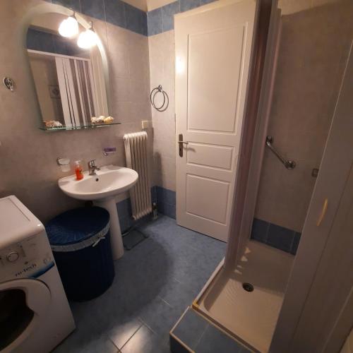 a small bathroom with a sink and a shower at piu verde1 in Nea Makri